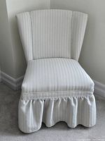 Front view of striped slipper chair