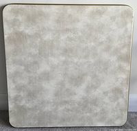 Top view showing beige laminate surface with rounded square shape