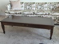 Full view of coffee table in front of sofa