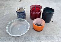 Top view of five pots and glass saucer