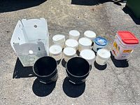 Group shot of all containers and box on pavement