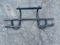 Full view of pull-up bar laid flat showing overall design and condition