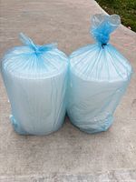 Two unopened rolls in blue protective bags