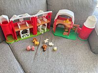 Barn playset fully opened with silo and animal figures arranged in front