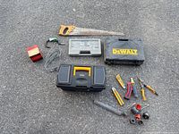 Group shot of all tools and cases laid out on asphalt