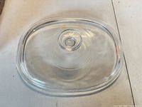 Top view of clear glass oval covered serving dish with lid