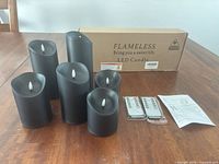 Six black LED candles, three remotes, instruction sheet, box
