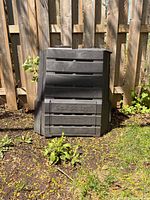 Front view of SoilSaver compost bin showing slatted sides and lower access panel