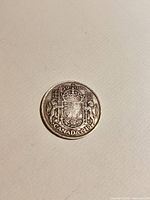 Reverse side with Canadian coat of arms and 50 Cents Canada 1940 legend
