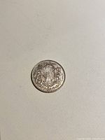 Reverse side with Canadian coat of arms