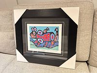 Front view of framed print with corner protectors