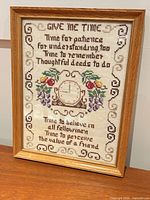 Front view of framed cross-stitch sampler