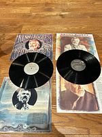 Both LPs with jackets and sleeves displayed