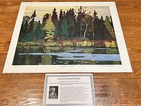 Full view of lithograph and bio card on wood surface