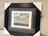 Full view of framed lithograph with corner protectors