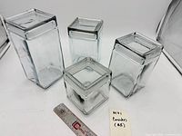 Set of four square glass Anchor Hocking canisters graduated sizes