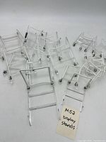 Group of clear acrylic display stands spread out