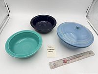 Overall view of three Fiesta bowls showing colors and lid