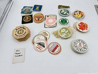 All coaster stacks laid out showing variety, shapes and prints