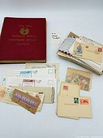Overall lot showing album, envelopes, loose stamps, souvenir cards