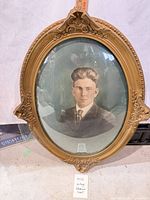 Front view of framed colorized portrait showing full frame and glass