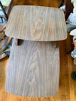 Top view of two-tier wood veneer end table showing overall design