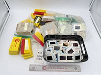 Overview of loose and bundled 35mm slides with packaging