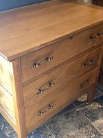 Front angled view showing dresser, drawer fronts, hardware, finish
