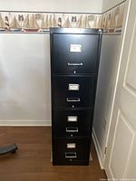 Full front view of black 4-drawer filing cabinet