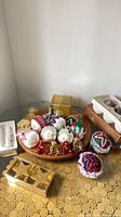 Overview of ornaments on wooden tray and candle sets