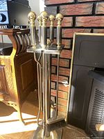 Full view of fireplace tool set on stand