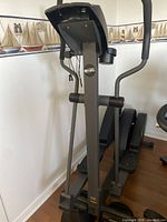 Full view of NordicTrack elliptical showing frame, pedals, console and handlebars