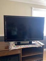 Front view of Sharp LCD TV on stand