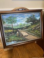 Full view of framed landscape painting