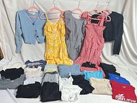 Full lot showing hanging garments and folded clothing