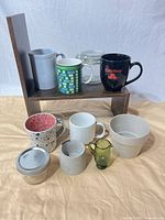 Group shot showing all ten pieces together on shelf and cloth
