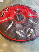 Full view of round towable tube showing color scheme, graphics and handles