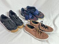 All three pairs laid out side by side showing uppers, laces, straps and soles