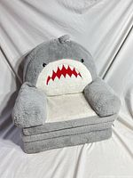 Front view of shark plush chair in folded seating position