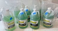 Six ComStar Coil Safe! 1-gallon bottles grouped together