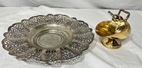 Top view of pierced filigree bowl beside gold-wash sugar scuttle