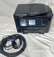 Printer front view with automatic document feeder and accessory cables