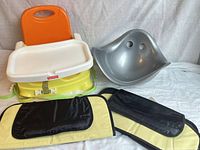Fisher-Price booster seat with tray, grey Bumbo seat, two folded Munchkin organizers