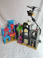 Front view showing both building sections and helicopter arm
