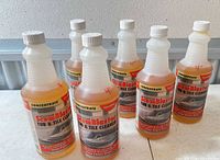 Front view showing six identical bottles with front labels visible