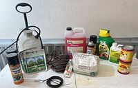 Overall lot showing all garden chemicals, sprayer, cords and wire