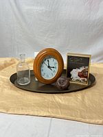 Group shot showing tray, clock, vase, paperweight, framed sign