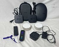 Group shot of all electronics, remotes, Bose cases and cables