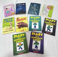 All ten books laid out showing front covers