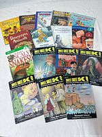 All fifteen children’s books laid out showing covers